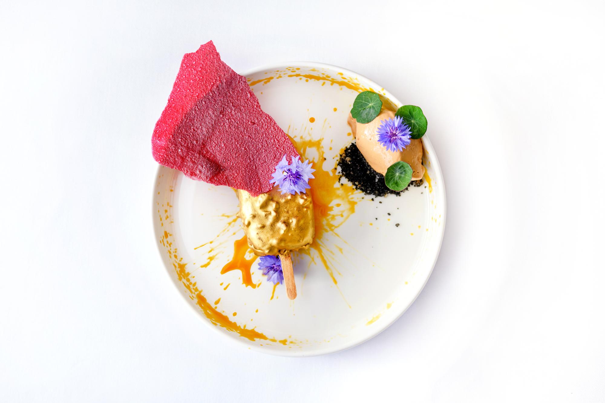 Closeup plated dessert with textured garnish